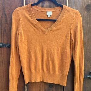 Orange V-neck knit sweater